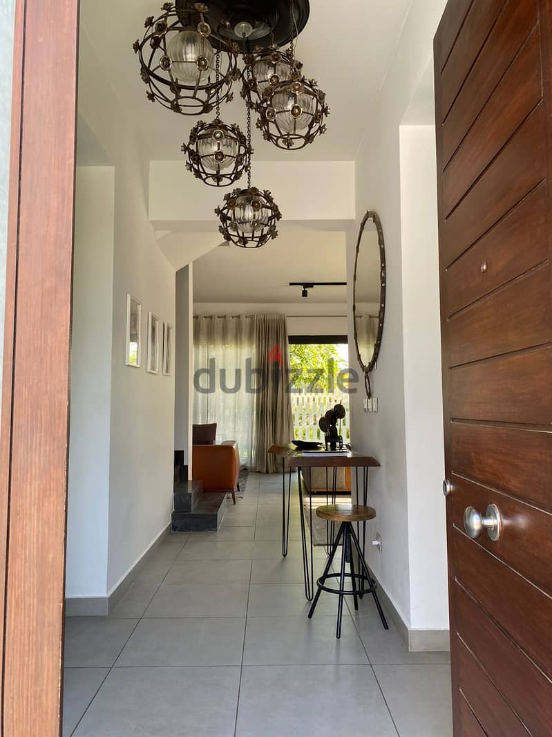 Duplex with garden for sale, in installments, fully finished and immediate receipt, distinctive location in Shorouk, Al Burouj Compound 2