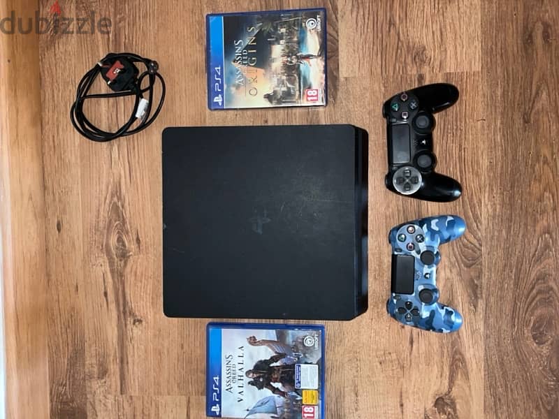 playstation4 with 2 orginal controllers and 2 games 1