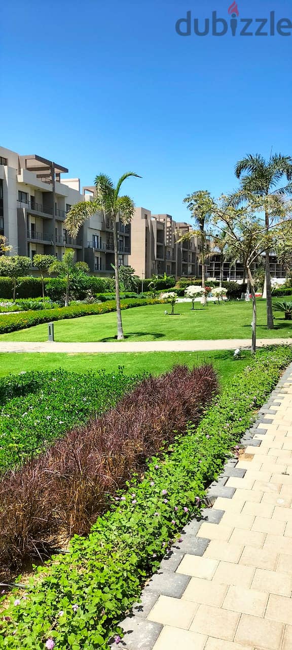 Apartment for sale with private garden, fully finished, with air conditioners  including maintenance, and are ready to move with an open view and l 2