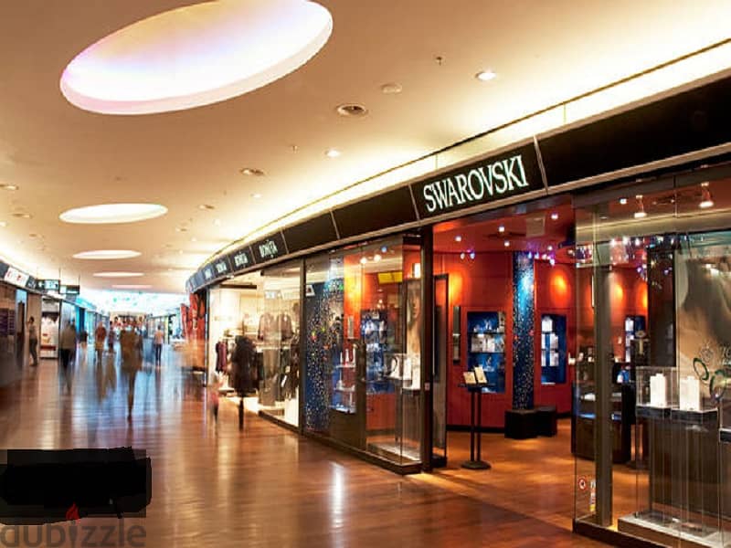 Ground floor shop, Pout area, 25 meters, with the lowest down payment and the longest payment period, in the only mall in the entertainment district i 10