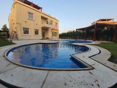 Villa for sale in Madinaty with special finishes, 4 bedrooms, a swimming pool, air conditioning, and a golf view.