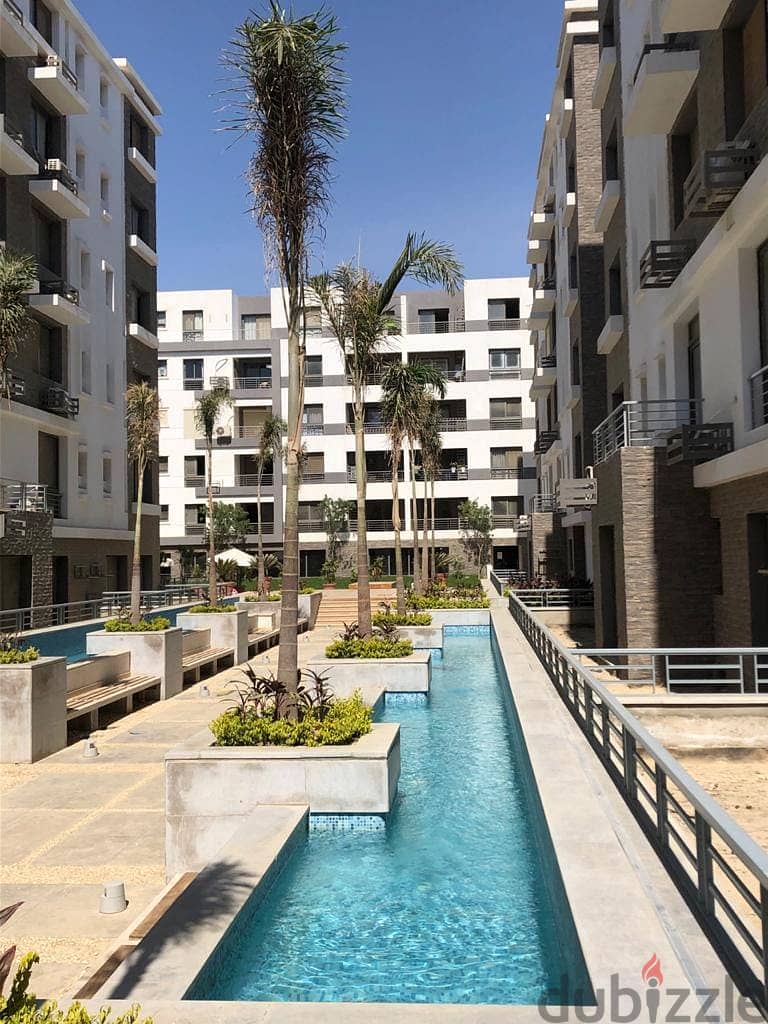 Double view corner apartment in Taj City Compound, area of ​​166 sqm, for sale, with a down payment of 590,000 and installments over 8 years 0
