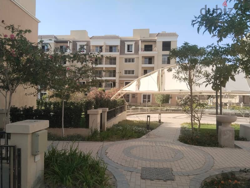Two rooms, 105 sqm, ground floor, 68 sqm garden, for sale in Sarai Compound on Suez Road, intersection with Al Amal Axis, with a 10% down payment and 15