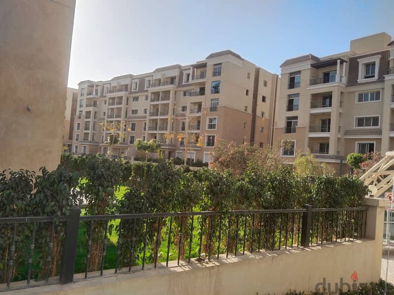 Two rooms, 105 sqm, ground floor, 68 sqm garden, for sale in Sarai Compound on Suez Road, intersection with Al Amal Axis, with a 10% down payment and 17