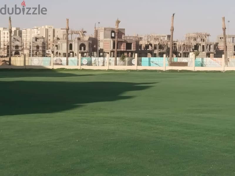 Two rooms, 105 sqm, ground floor, 68 sqm garden, for sale in Sarai Compound on Suez Road, intersection with Al Amal Axis, with a 10% down payment and 21