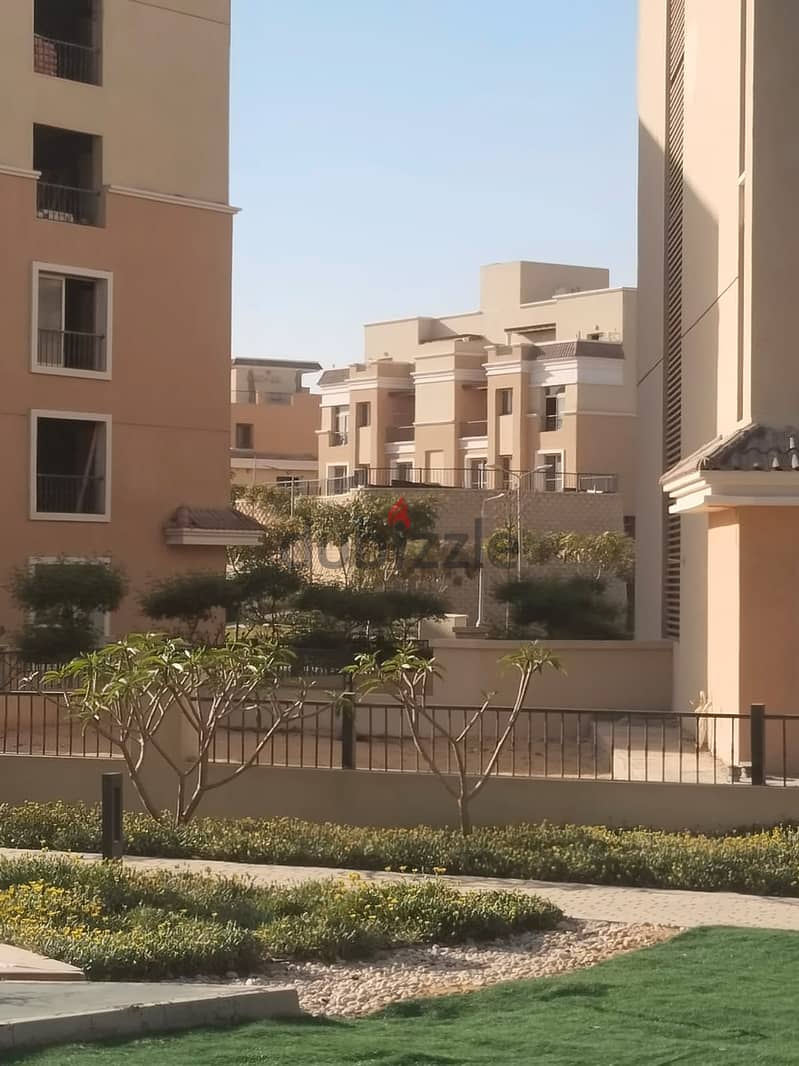 Two rooms, 105 sqm, ground floor, 68 sqm garden, for sale in Sarai Compound on Suez Road, intersection with Al Amal Axis, with a 10% down payment and 23