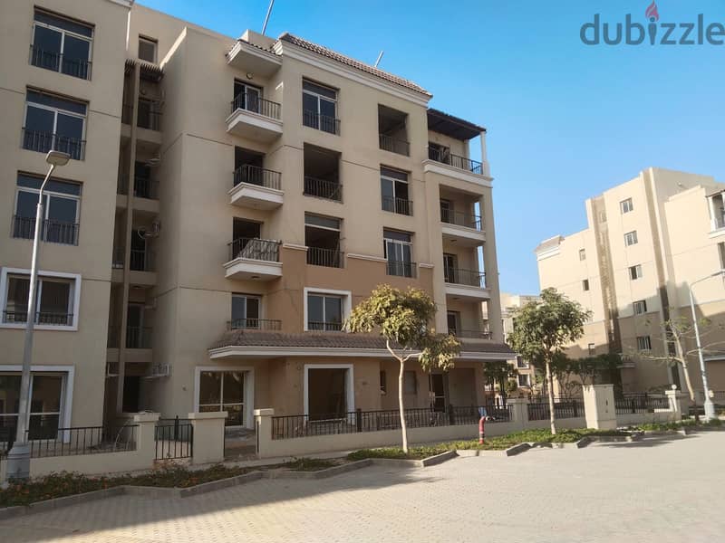 Two rooms, 105 sqm, ground floor, 68 sqm garden, for sale in Sarai Compound on Suez Road, intersection with Al Amal Axis, with a 10% down payment and 26