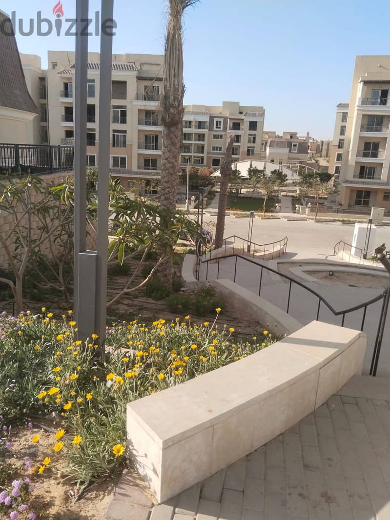 Two rooms, 105 sqm, ground floor, 68 sqm garden, for sale in Sarai Compound on Suez Road, intersection with Al Amal Axis, with a 10% down payment and 27