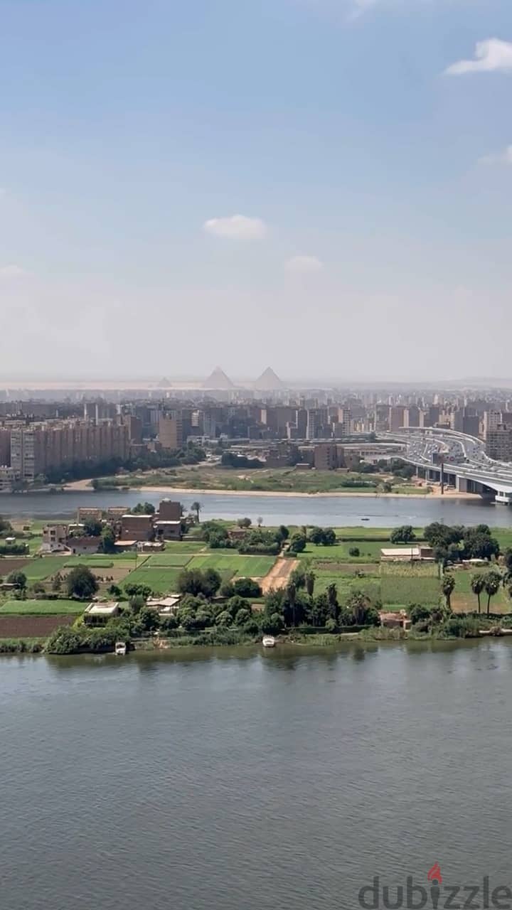 For sale, a hotel apartment directly overlooking the Nile, immediate receipt, fully finished, with a distinctive location (Service by Hilton) 4