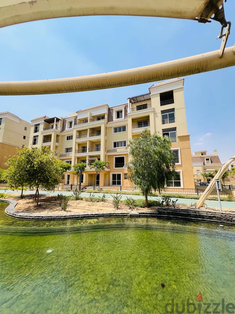 Triplex with direct view, 220 m, roof 127 m, for sale in Sarai Compound near the Administrative Capital and Madinaty, with a down payment starting fro 18