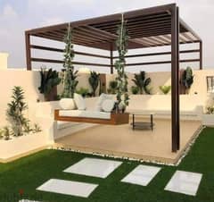 Apartment for sale with a private garden in the settlement, on the landscape, in the Taj City Compound, directly in front of the airport