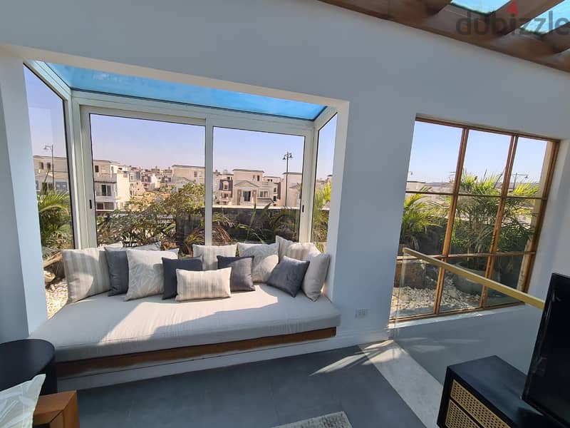 For sale, a villa with a fantastic view in the best location in Mountain View iCity October, next to the Shooting Club on the Boulevard axis 5
