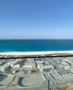 Hotel apartment for sale with a down payment of 2.7 million, wonderful sea view in New Alamein, installment 0