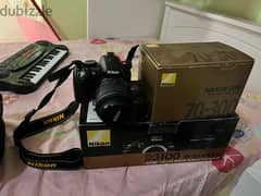 Nikon D3100 +18-55mm lens+70-300mm lens