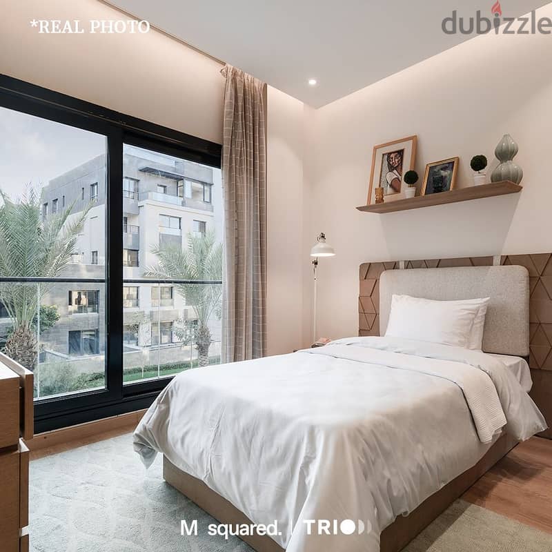 With the lowest down payment, an apartment for sale, 230 meters, in Trio Garden - New Cairo, 4 bedrooms, with a distinctive view, installment 9 year 8