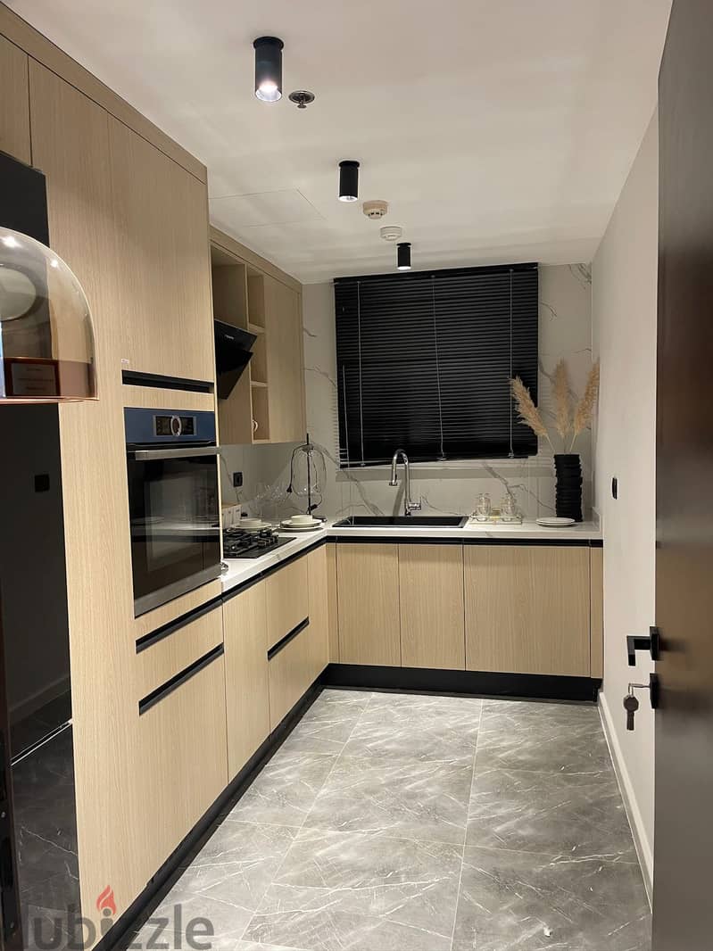 A fully finished smart home hotel apartment with hotel furnishings for sale on Al Thawra Street in the Marriotte Residence Helioplolis Compound. 3