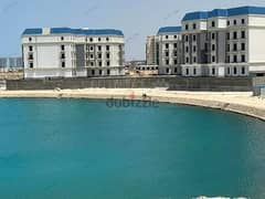 For sale in the Latin Marine District, a finished apartment, receiving prime location, on Lake Alamein and the towers directly, in installments 0