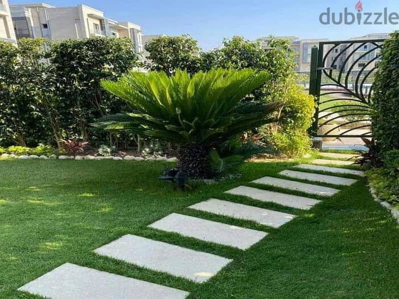 Apartment with garden for sale, 131 square meters, in Taj City Compound, First Settlement, next to Madinaty, in front of Cairo International Airport 1