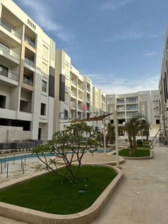 Apartment for sale in installments, fully finished, on a very special landscape, in the Sheraton (Al Jar) Compound