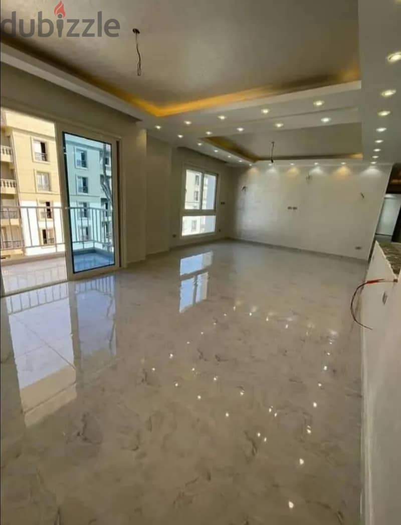 Finished apartment for sale, immediate receipt, in Al Maqsad Compound, the Administrative Capital, with a distinctive view on the iconic tower, with f 1