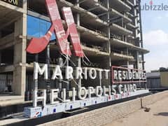 لاول مرة شقة فندقية بمقدم 890 الف في قلب مصر الجديدة بتشطيب فندقي بخدمات فندق ماريوت علي شارع الثورة مباشرة