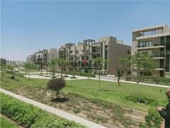 Apartment for sale with a private garden, in installments, fully finished, with air conditioners, at a price including maintenance and garage, with an