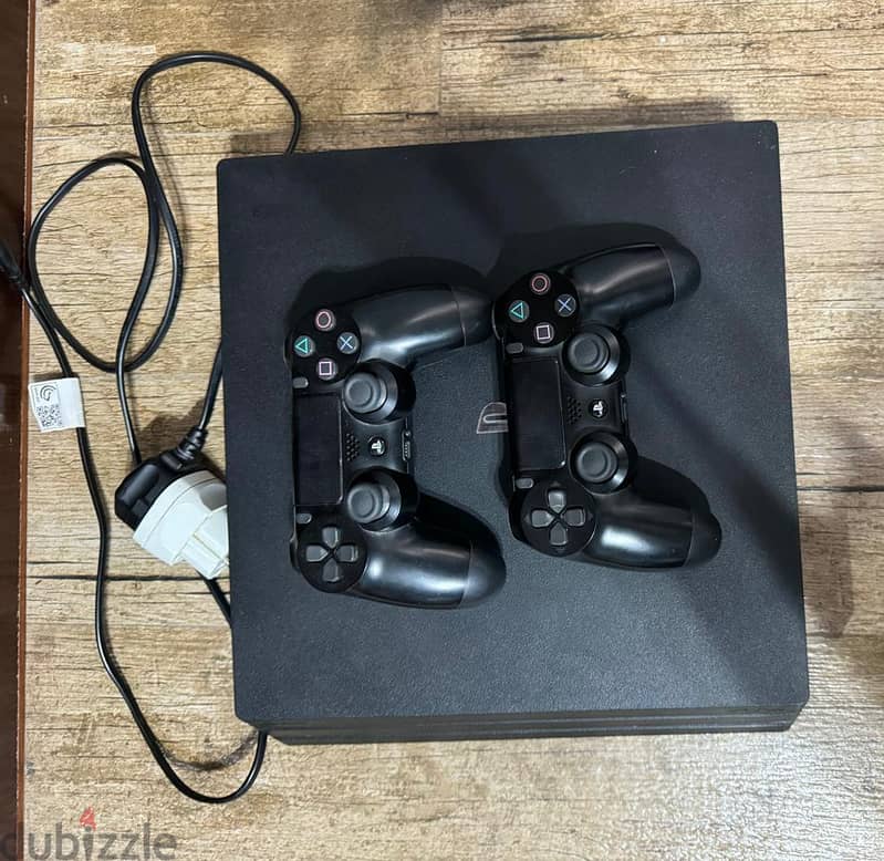 used playstation 4 pro + two original controllers 1