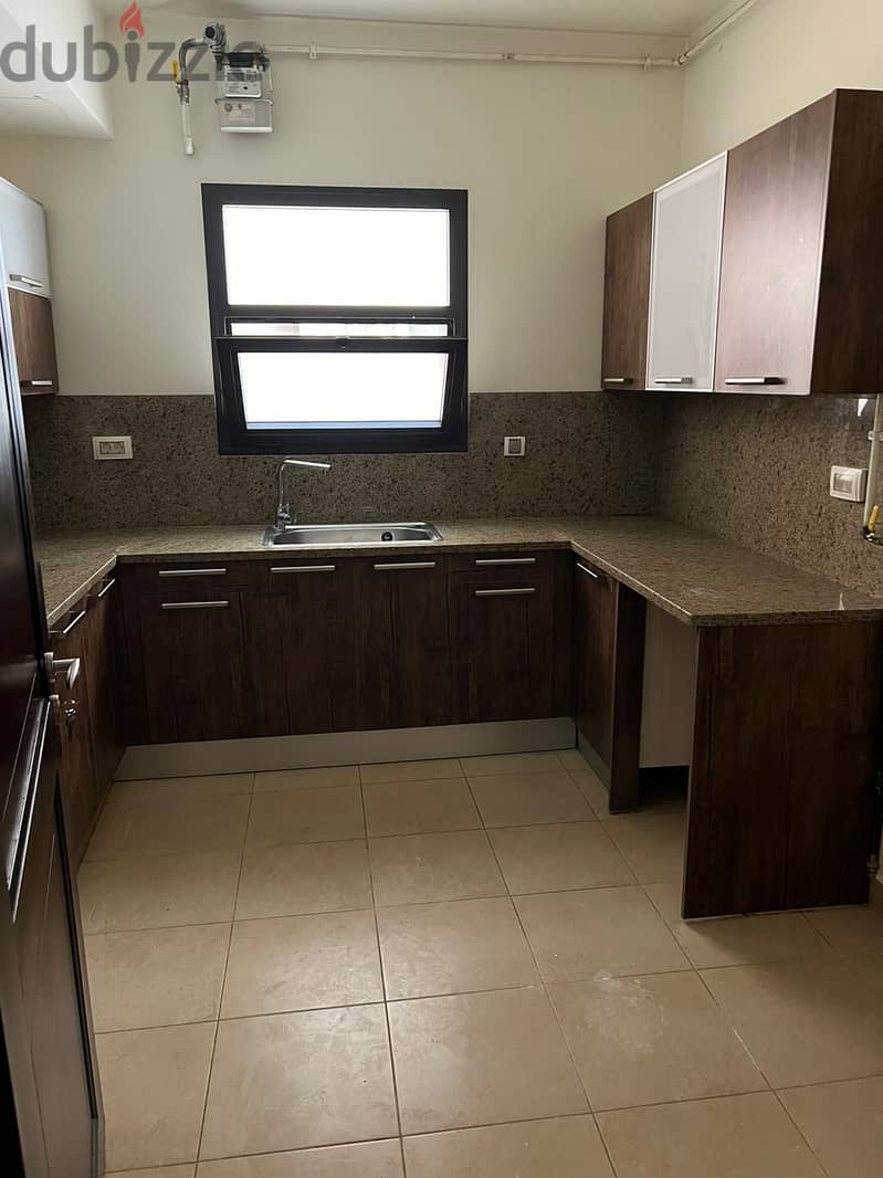 garden view apartment for rent (with kitchen & ac's) in mivida new cairo 6