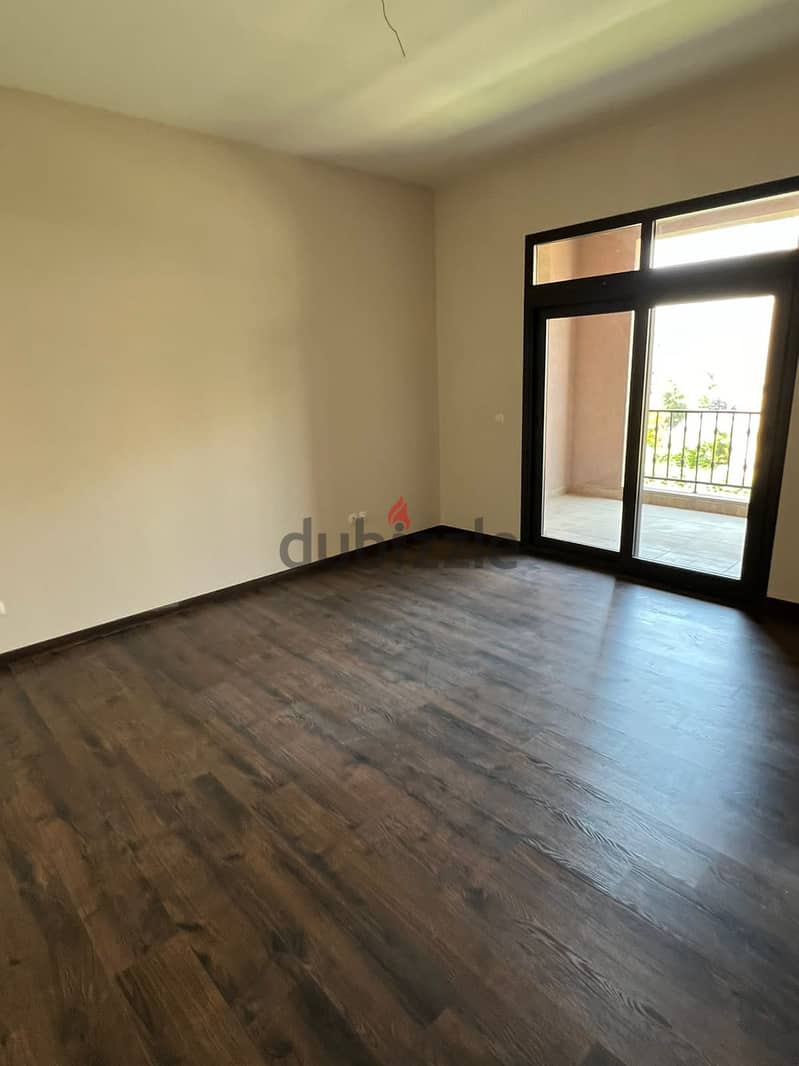 garden view apartment for rent (with kitchen & ac's) in mivida new cairo 9