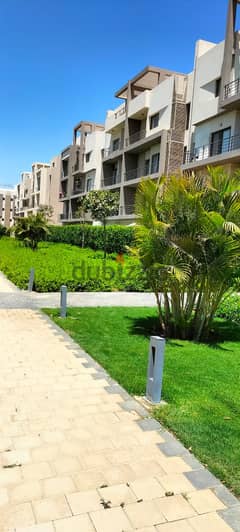 Apartment for sale with private garden, fully finished, with air conditioners and ready to move with an open view and landscape 0