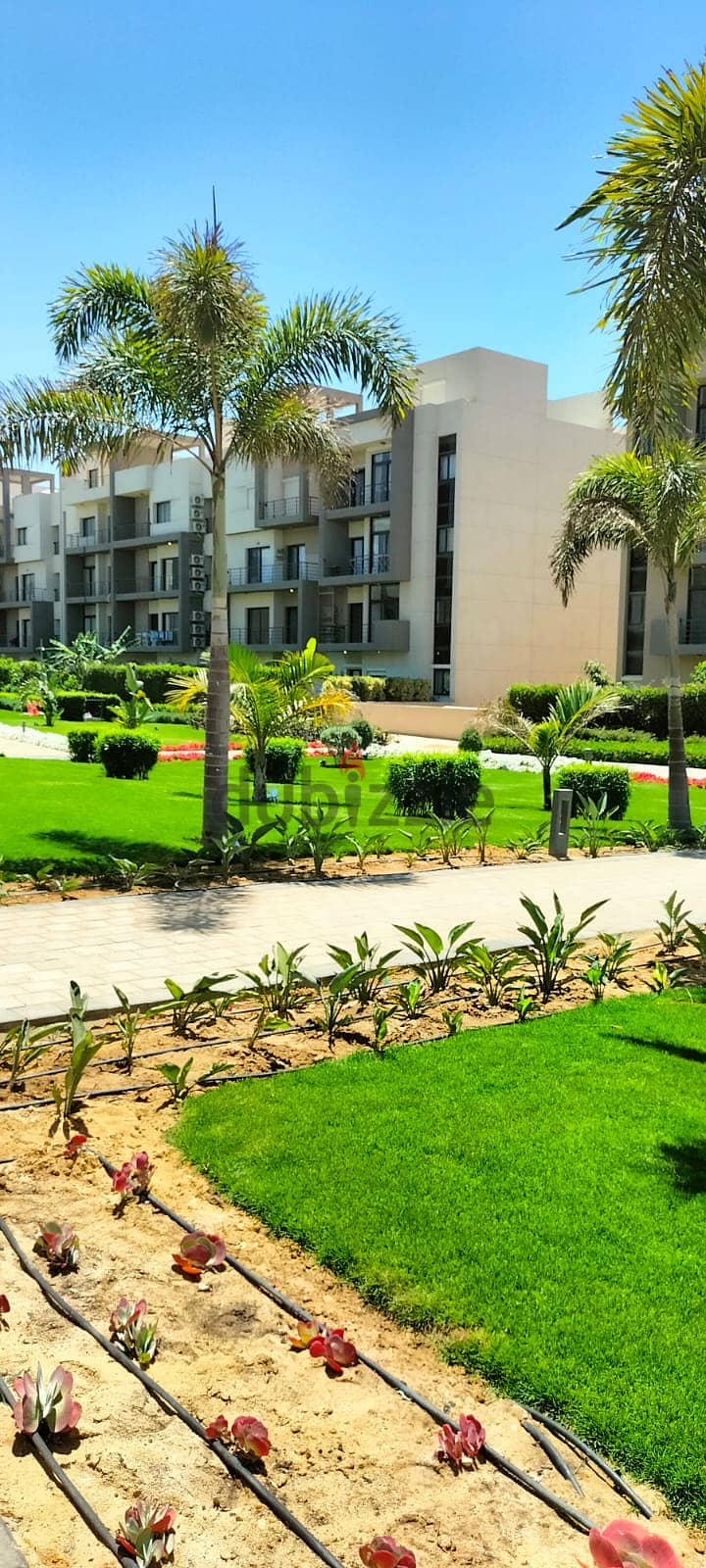 Apartment for sale with private garden, fully finished, with air conditioners and ready to move with an open view and landscape 6