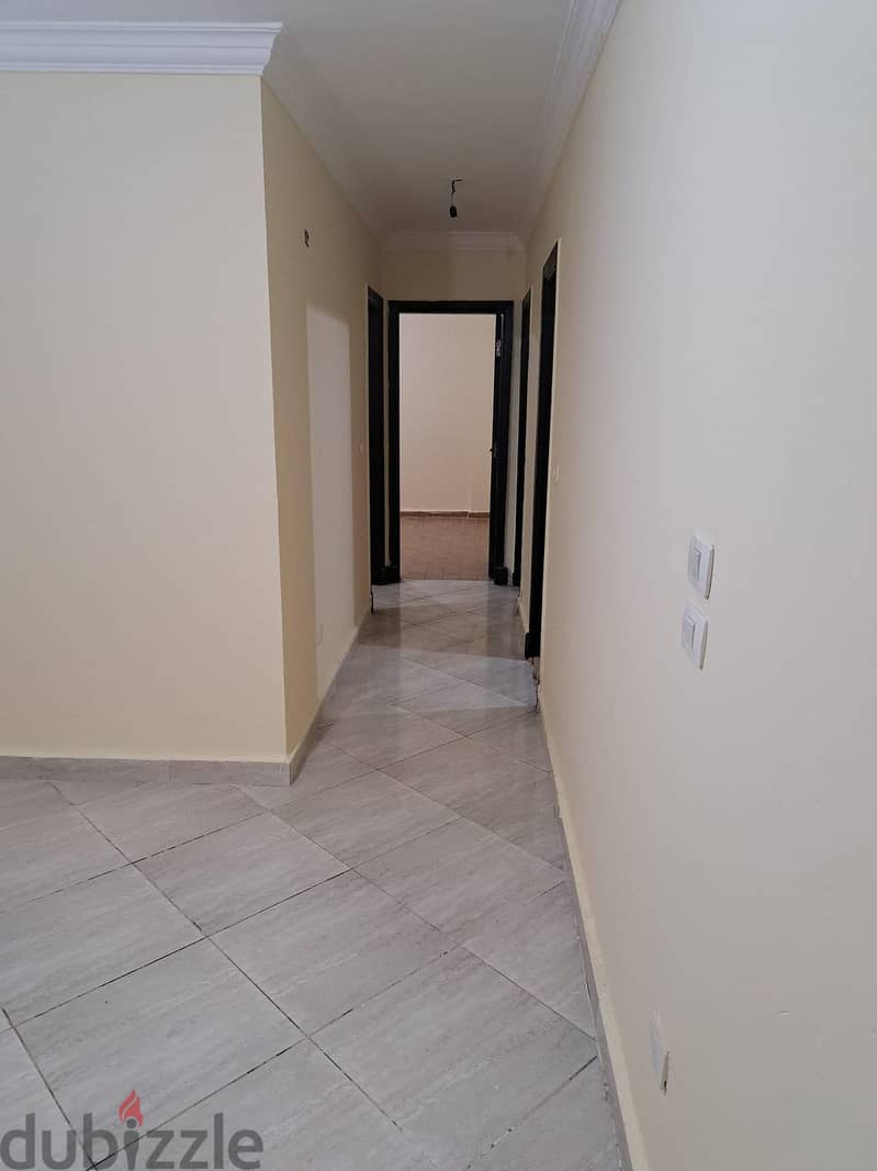 Apartment for sale in Dar Misr Al-Qronfol Compound, near Gates 1 and 2 View Garden behind 1