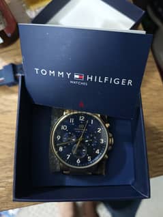 ساعة Tommy Hilfiiger ذهبي اصلي بالعلبة و الكاتالوج