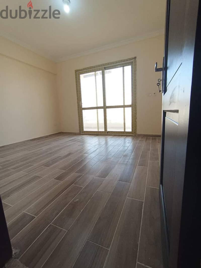 Apartment for sale in Jannat Zayed 2, area of ​​130 meters, third floor, elevator, 3 rooms and 2 bathrooms, down payment of 2,800,000, and the rest in 4