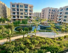 Ground floor apartment with a very special garden view for sale in Taj City Compound in front of Cairo International Airport near Heliopolis 0