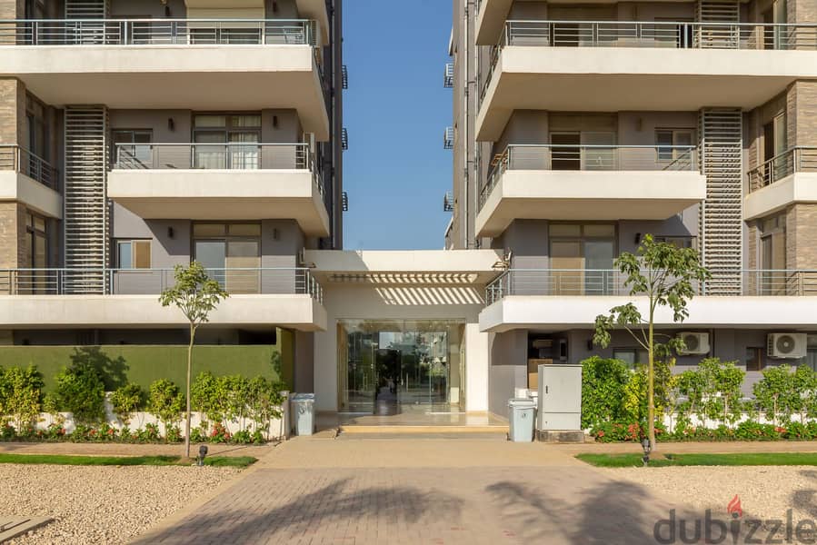 Ground floor apartment with a very special garden view for sale in Taj City Compound in front of Cairo International Airport near Heliopolis 5