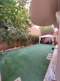 For sale, a ground floor apartment with a garden and a private entrance in Al-Fardous Investment Villas, in front of Dreamland