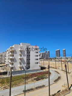 Own a fully finished apartment with garden for sale in New Alamein, immediate delivery, in Mazarine | City Edge | city ​​edge
