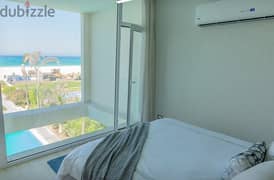 a fully finished chalet with lagoon view in El-Ain El-Sokhna before Porto in | Telal El-Sokhna | resort is directly on Sea with installments over 8y 0