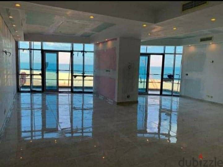 A hotel apartment directly on the sea for sale with a down payment of 6.9 million in New Alamein Towers 4