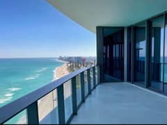 Double apartment with sea and lagoon view for sale, immediate receipt, finished, in El Alamein, next to City Edge Towers