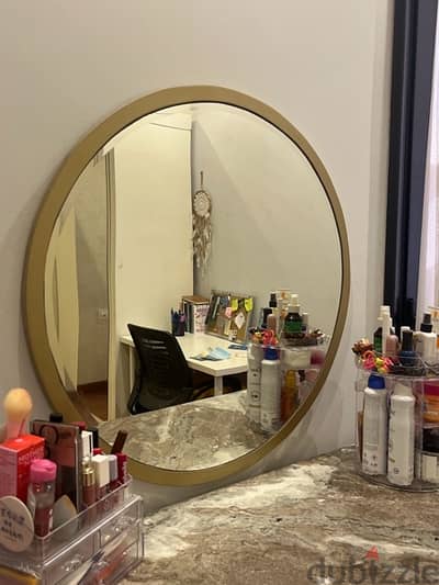 Gold round mirror