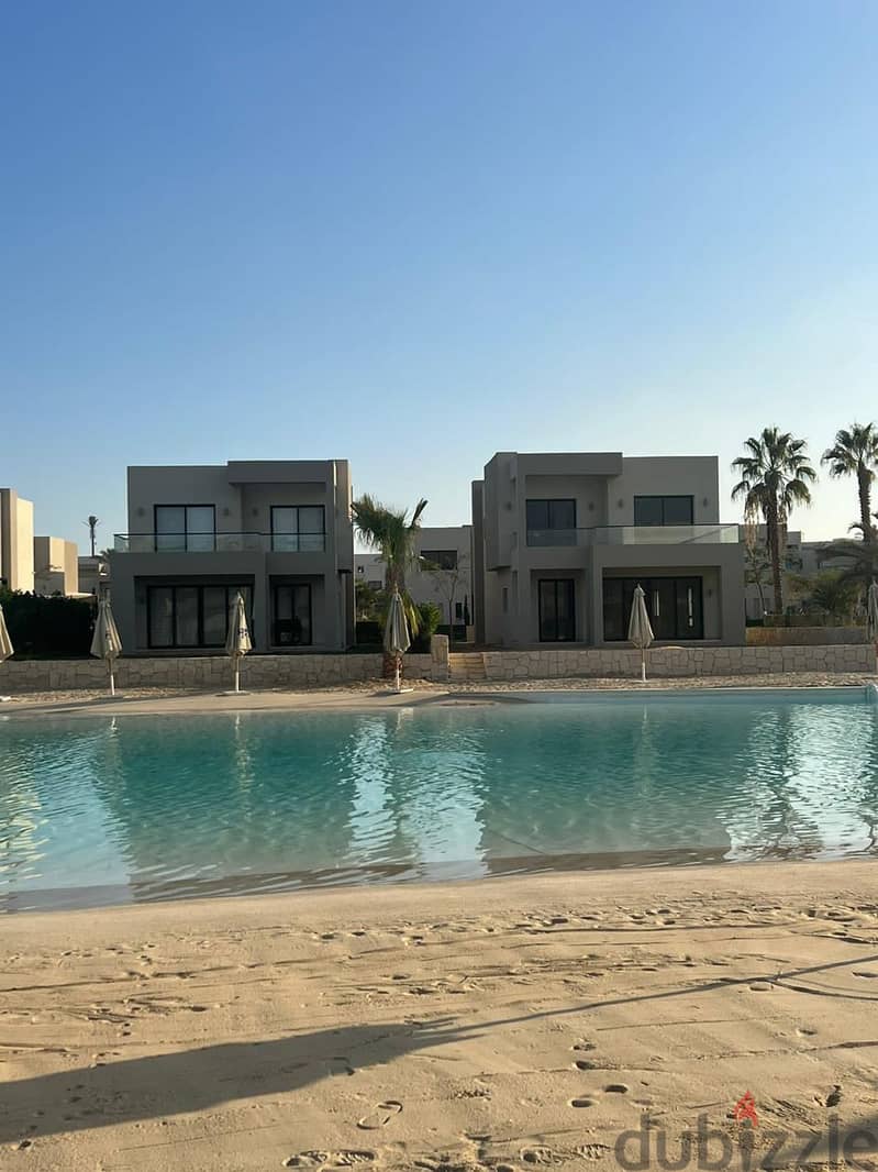 Chalet for sale, 125 meters, finished, with air conditioners, in Azha, North Coast, double view, sea + lagoon, with a 10% down payment and installment 2