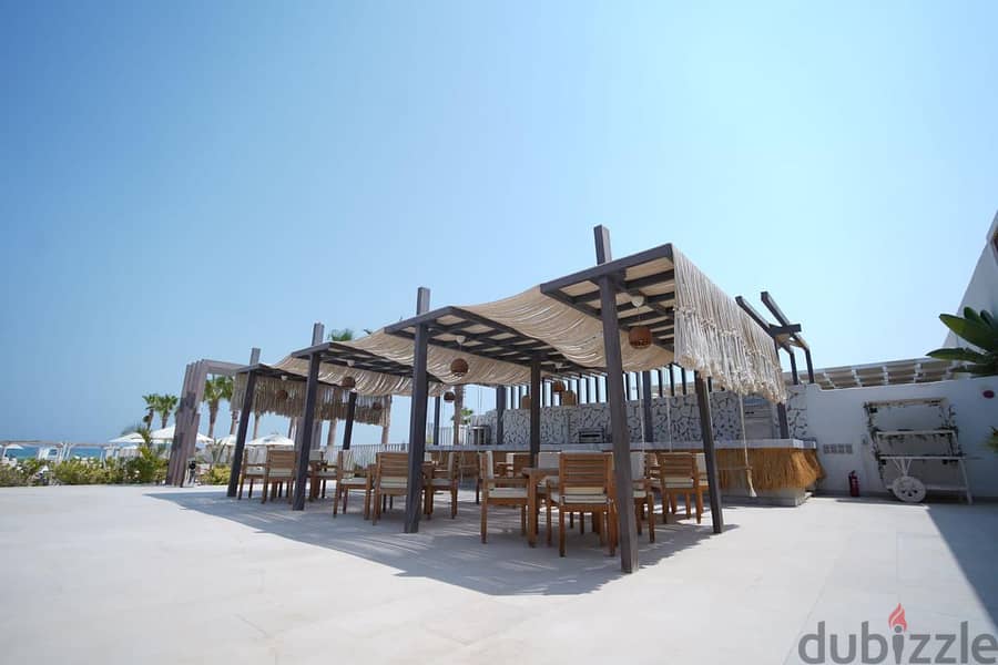 Chalet for sale, 125 meters, finished, with air conditioners, in Azha, North Coast, double view, sea + lagoon, with a 10% down payment and installment 5