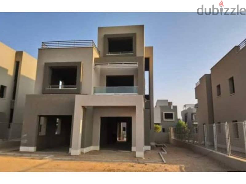Townhouse for sale in the best location in New Cairo semi-finished, with private roof 1