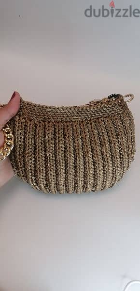 golden colored handmade crochet bag