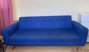 Blue sofa turns into bed