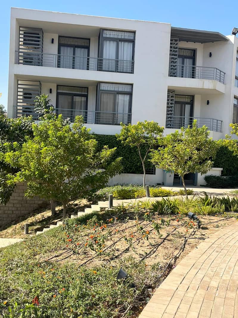 An apartment with a garden for sale with a down payment of 1,255,000 in a prime location in El Tagamoa 3