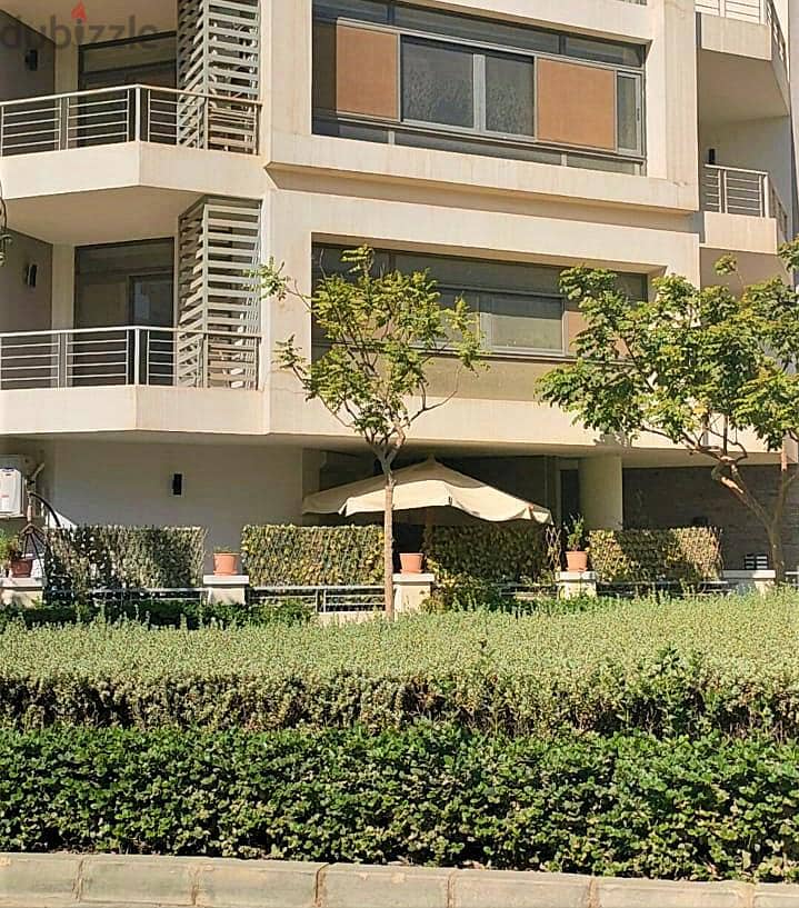 An apartment with a garden for sale with a down payment of 1,255,000 in a prime location in El Tagamoa 8