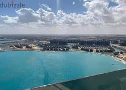 Chalet for sale in Al Alamein Towers, ultra super luxury finishing + nearest receipt + central air conditioning + sea view to the sea